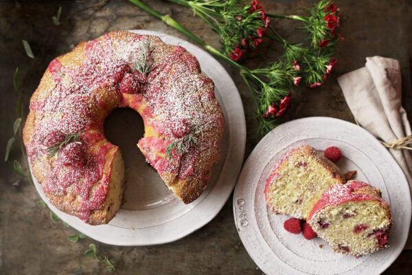 Lemon Raspberry Coffee Cake on white platters topped with powdered sugar
