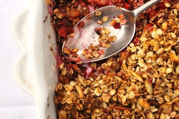 Raspberry Apple Granola Crumble with a serving spoon