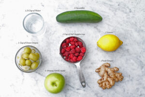 Ingredients, water, cucumber, lemon, IQF raspberries, green grapes, granny smith apple, fresh ginger