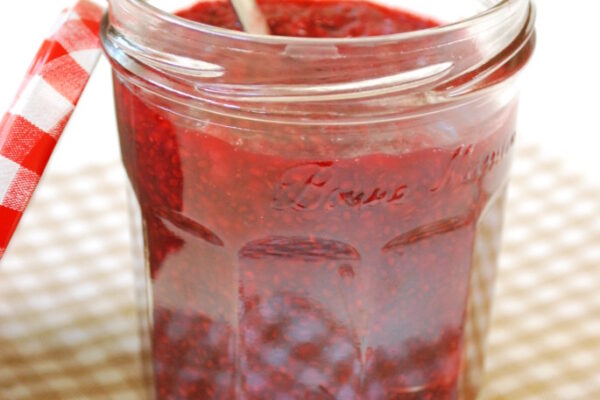 Raspberry Meyer Lemon Chia Jam in jar with spoon