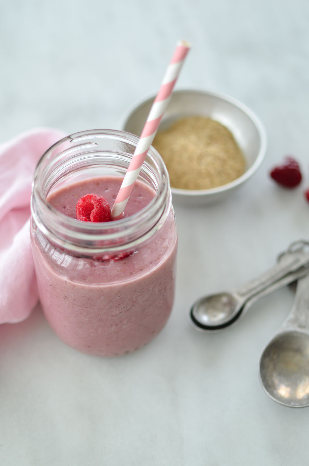 Frozen raspberry smoothie in mason jar