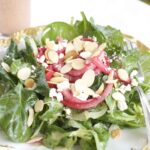 Spinach And Frisee Salad With Raspberry Pickled Onions & Raspberry Vinaigrette