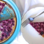 Raspberry Clafoutis with one piece on white plate